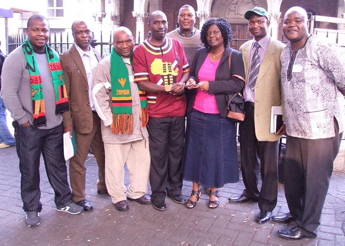 Zambian student group with cooking stick